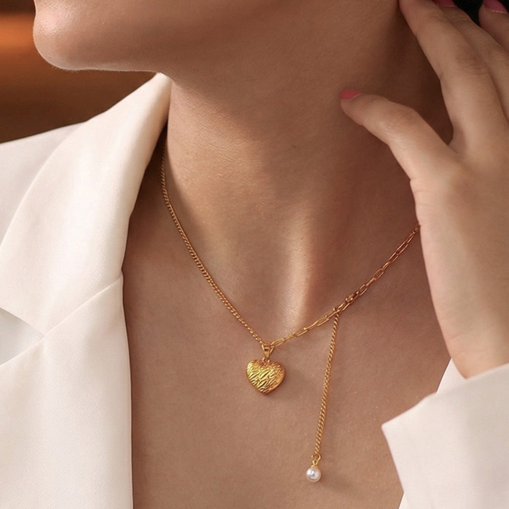 Textured heart necklace with freshwater pearl tassel detail