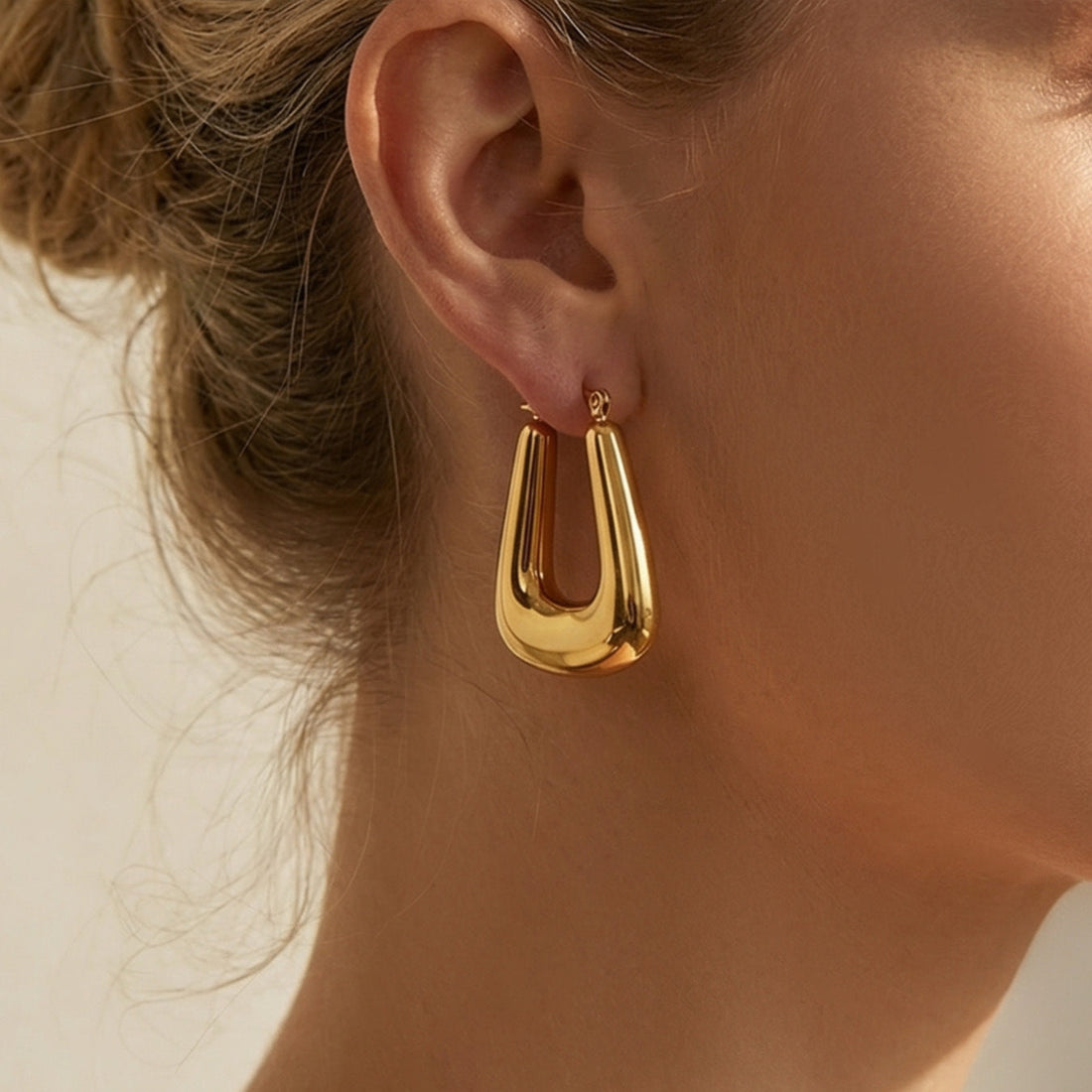 U-shaped chunky hoop earrings with a gold-plated finish for a thoughtful Christmas gift for her