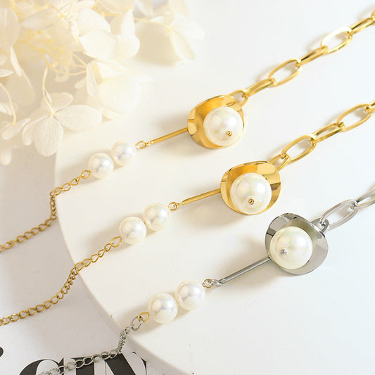Geometric disc bracelet with faux pearl accent in gold or steel-tone titanium steel