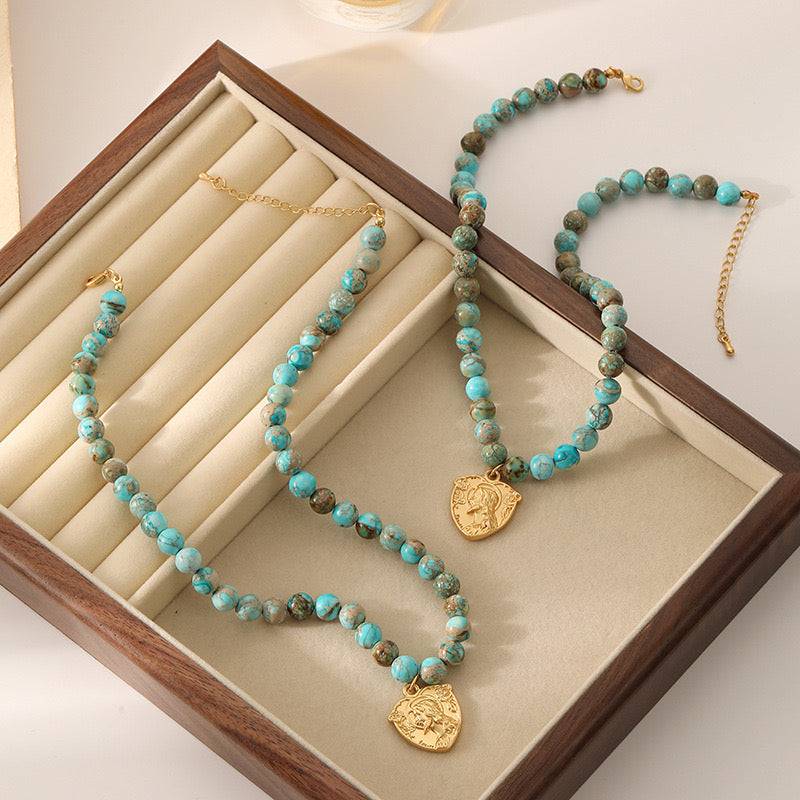 turquoise beaded necklace carved Figurative coin pendant